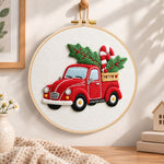Red pick up with holly embroidery hoop wall art displayed as warm and cozy handmade home decor