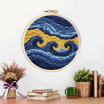 Finished abstract blue and gold waves artwork displayed on a wall