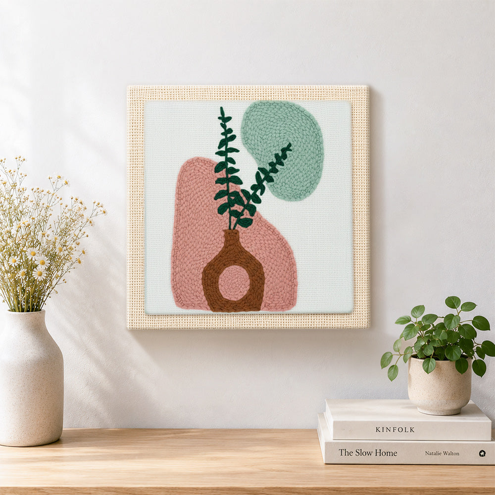 Finished abstract geometric vase artwork displayed on a wall