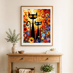 Finished abstract long cats in flowers cross stitch artwork displayed as home decor