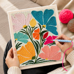Creating handmade abstract multicolor fan flowers punch needle artwork