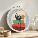 Abstract potted plant punch needle artwork displayed on a table