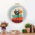 Finished abstract potted plant artwork displayed on a wall