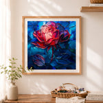 Finished abstract stained-glass red rose cross stitch artwork displayed as home decor