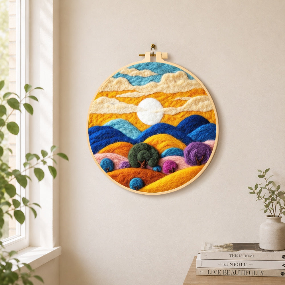 Abstract wavy clouds and colorful hills needle felt wall art displayed in a bright home interior