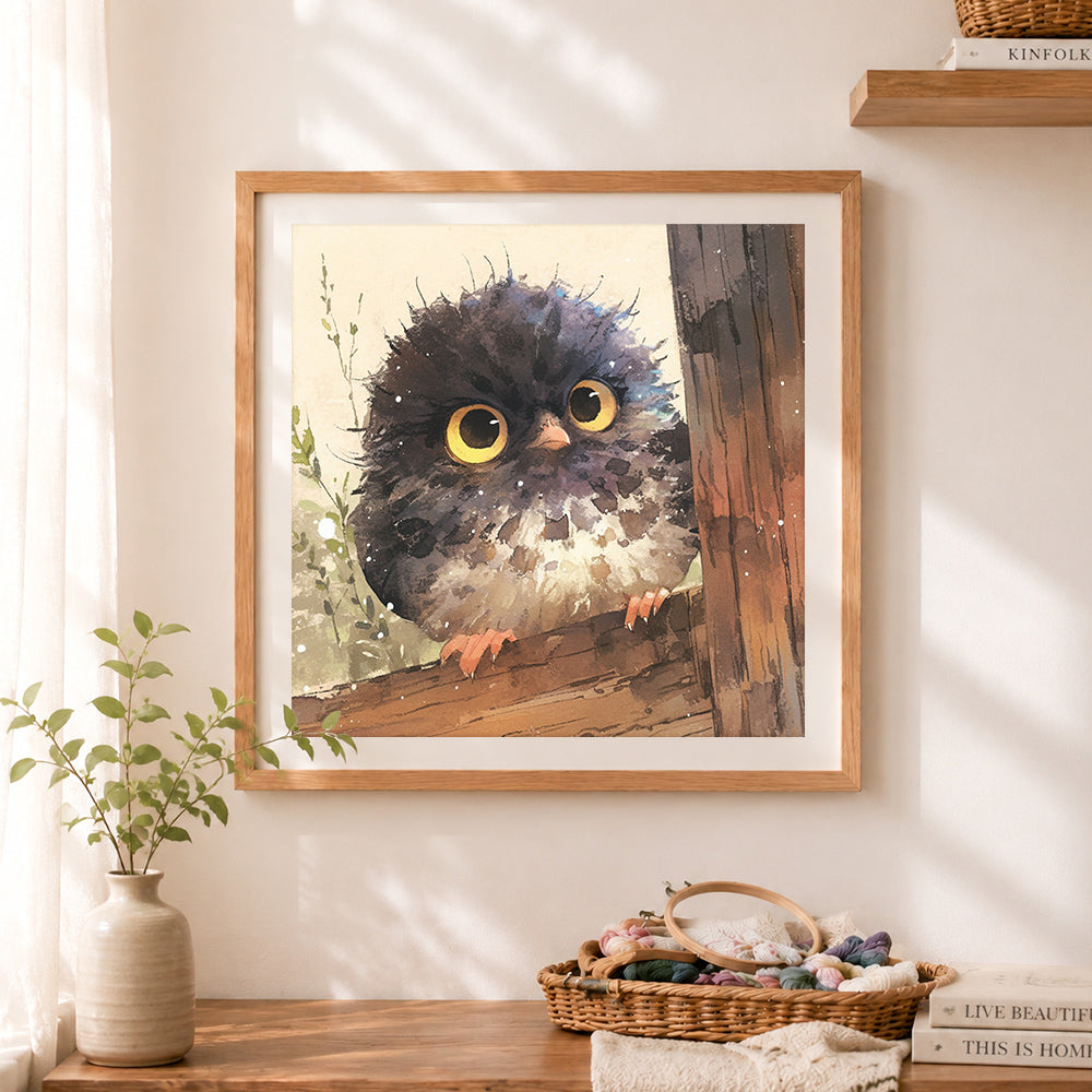 Finished adorable fluffy owl on branch cross stitch artwork displayed as home decor