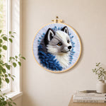 Adorable gray wolf needle felt wall art displayed in a bright home interior