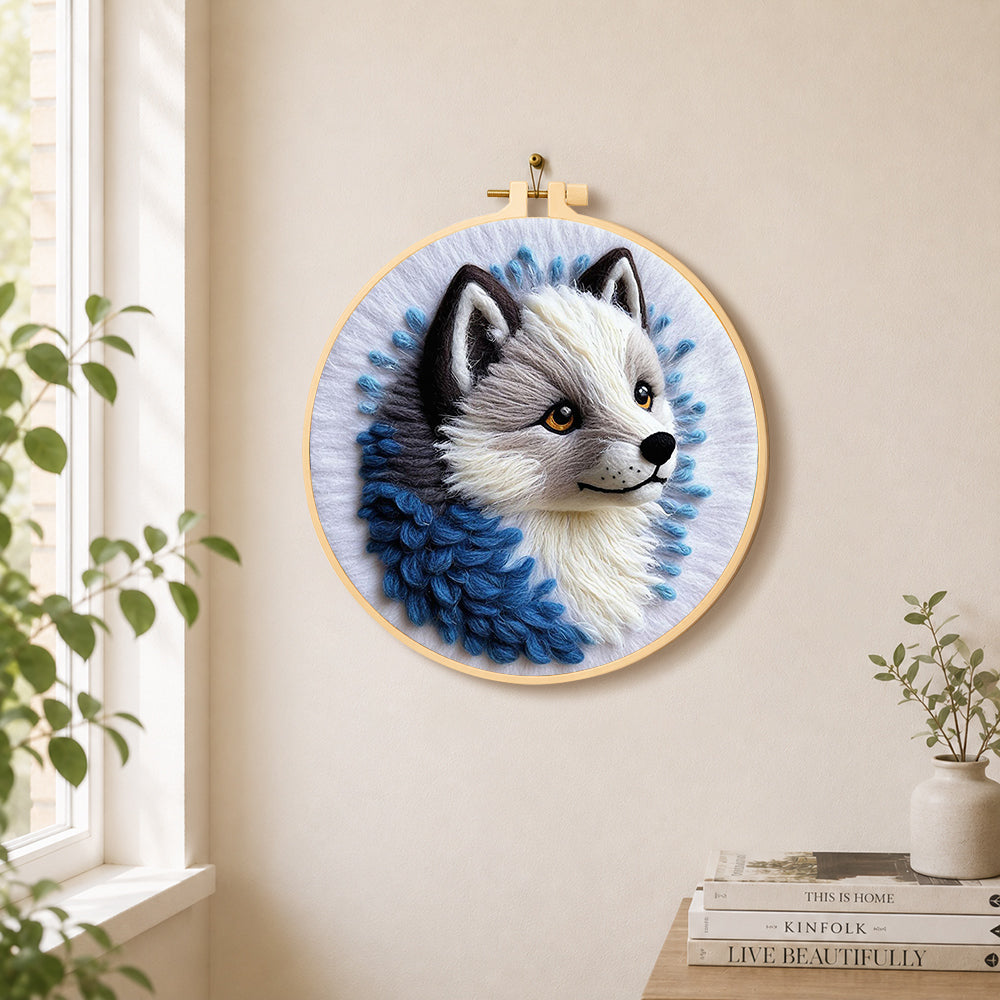 Adorable gray wolf needle felt wall art displayed in a bright home interior