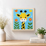 Finished adorable love-themed giraffe artwork displayed on a wall