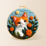 Adorable orange and white kitten needle felting kit for beginners with a round wooden frame