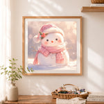 Finished adorable pink scarf snowman cross stitch artwork displayed as home decor