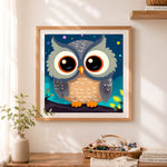 Finished adorable sleepy owl cross stitch artwork displayed as home decor