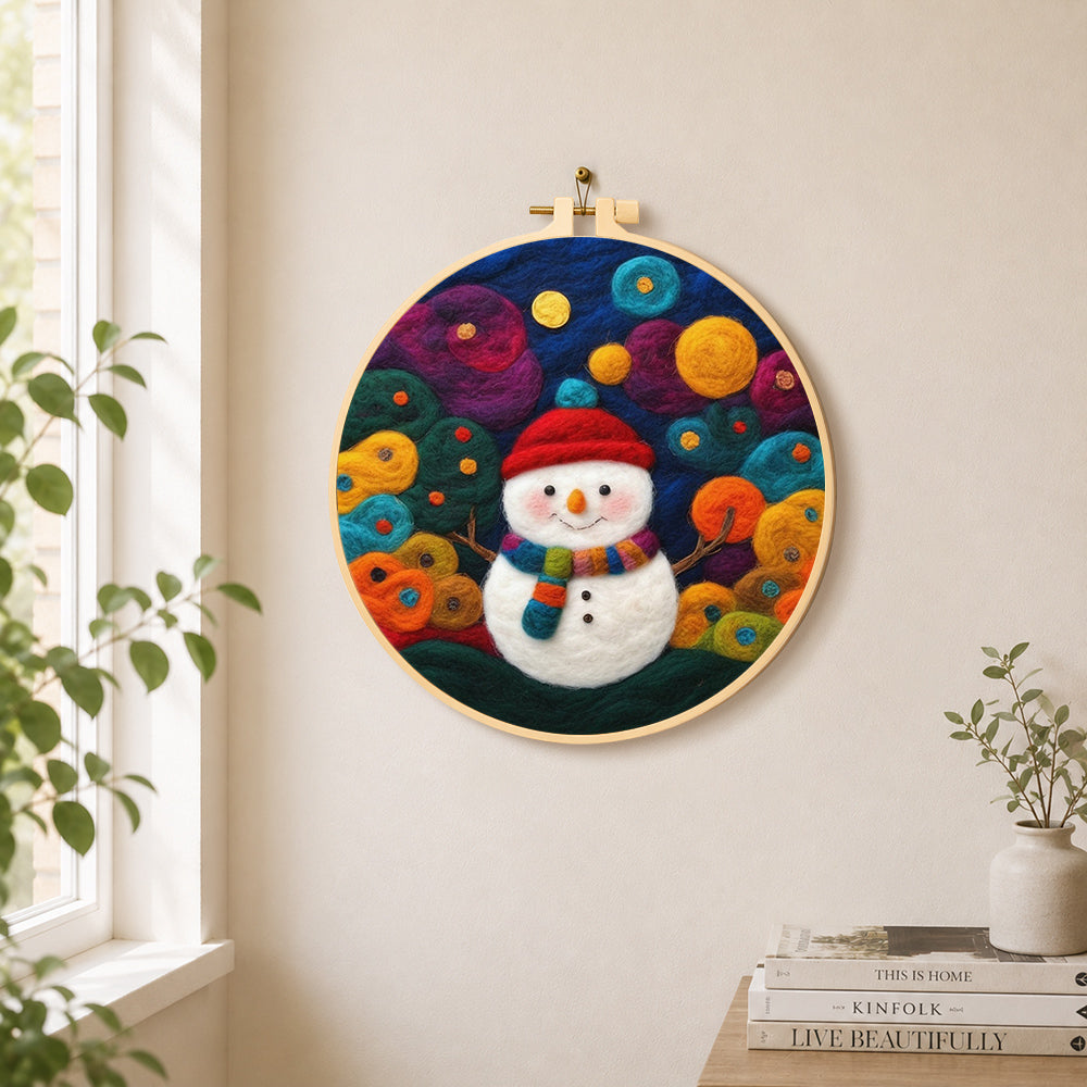 Adorable snowman with scarf needle felt wall art displayed in a bright home interior