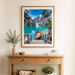 Finished alpine turquoise lake cross stitch artwork displayed as home decor