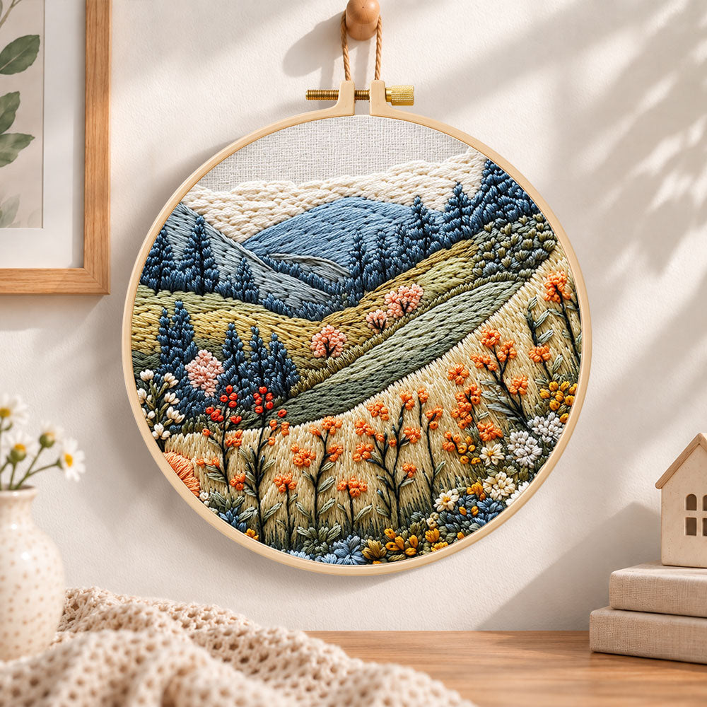 Alpine wildflower slopes embroidery hoop wall art displayed as warm and cozy handmade home decor