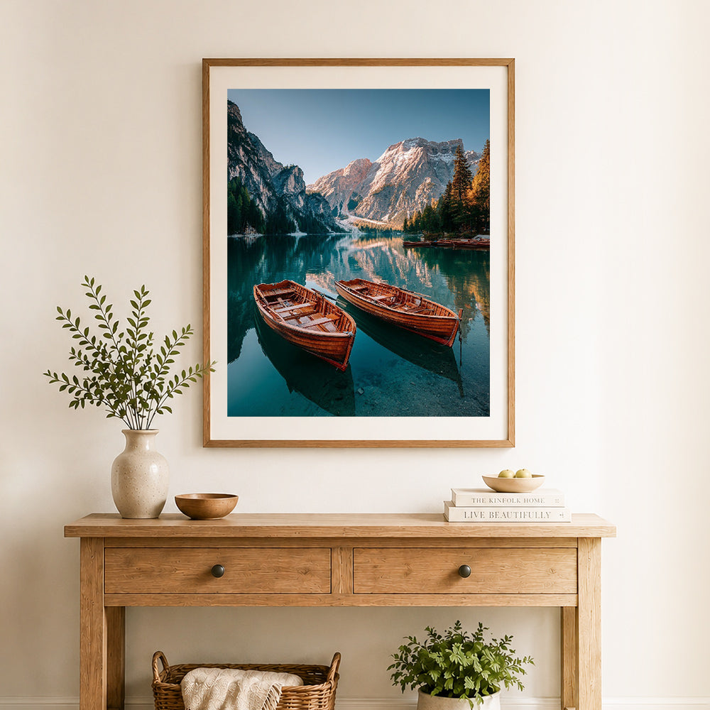 Finished alpine wooden boats cross stitch artwork displayed as home decor