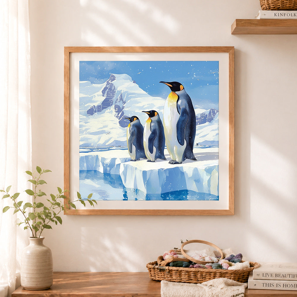 Finished antarctic penguin family cross stitch artwork displayed as home decor
