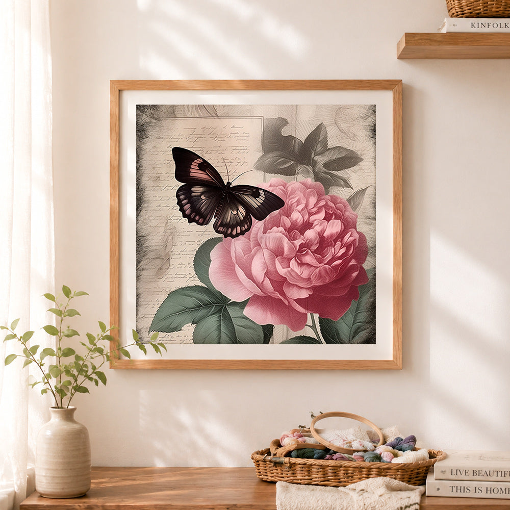 Finished antique rose & dark butterfly art cross stitch artwork displayed as home decor