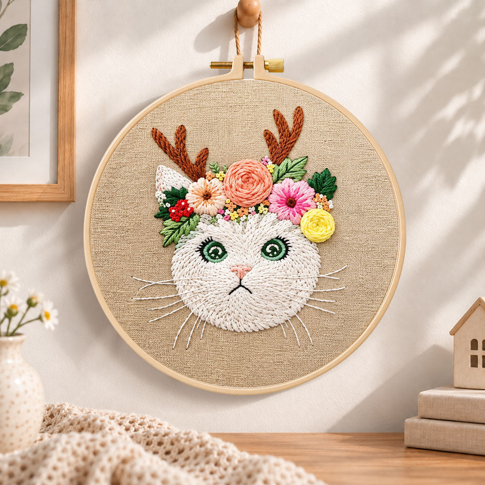 Antler flower kitten embroidery hoop wall art displayed as warm and cozy handmade home decor