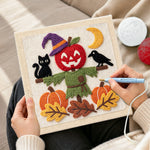 Creating handmade apple scarecrow scene punch needle artwork
