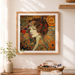 Finished art nouveau spiraling girl portrait cross stitch artwork displayed as home decor