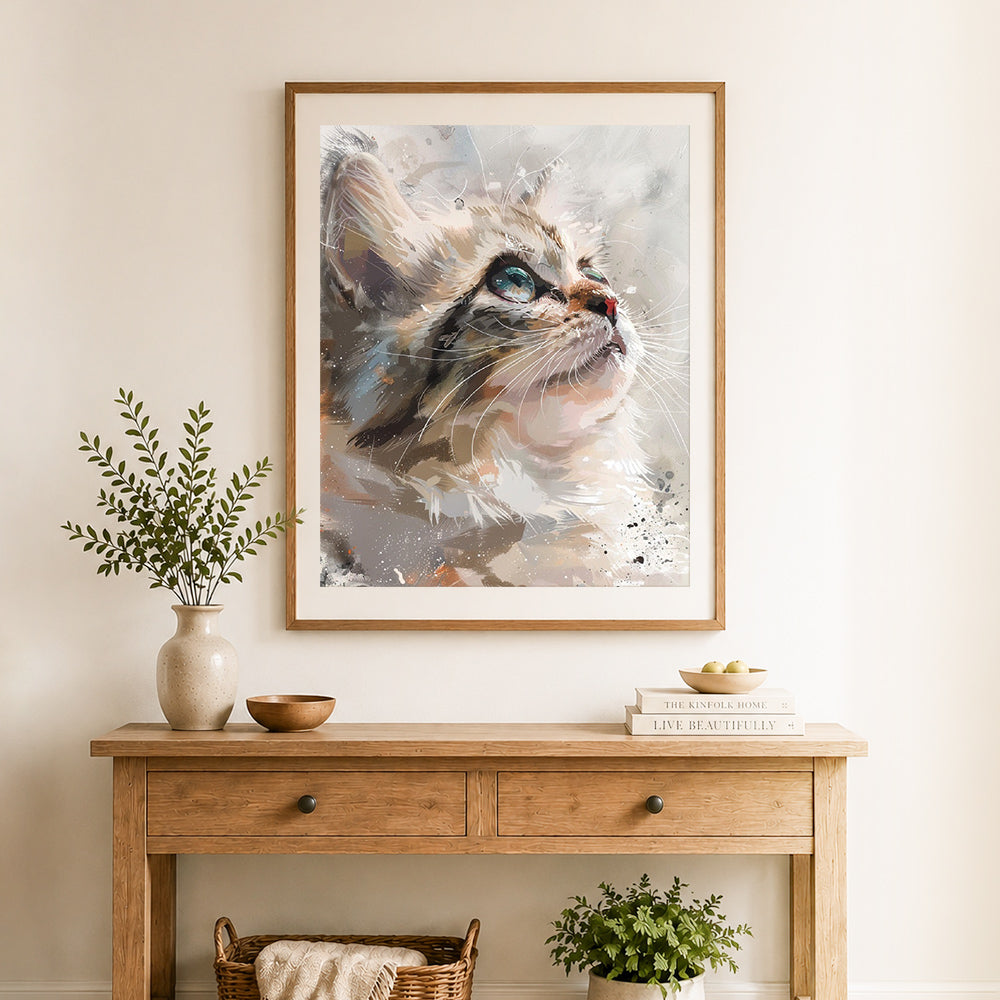 Finished artistic tabby cat portrait cross stitch artwork displayed as home decor