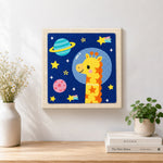 Finished astronaut giraffe with planets artwork displayed on a wall