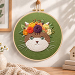 Autumn flower cat embroidery hoop wall art displayed as warm and cozy handmade home decor