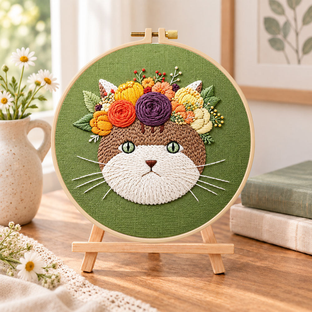 Autumn flower cat embroidery kit finished hoop displayed on a wooden stand as cozy tabletop decor