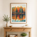 Finished autumn forest reflection on calm lake cross stitch artwork displayed as home decor