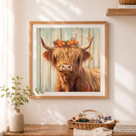 Finished autumn highland cow cross stitch artwork displayed as home decor