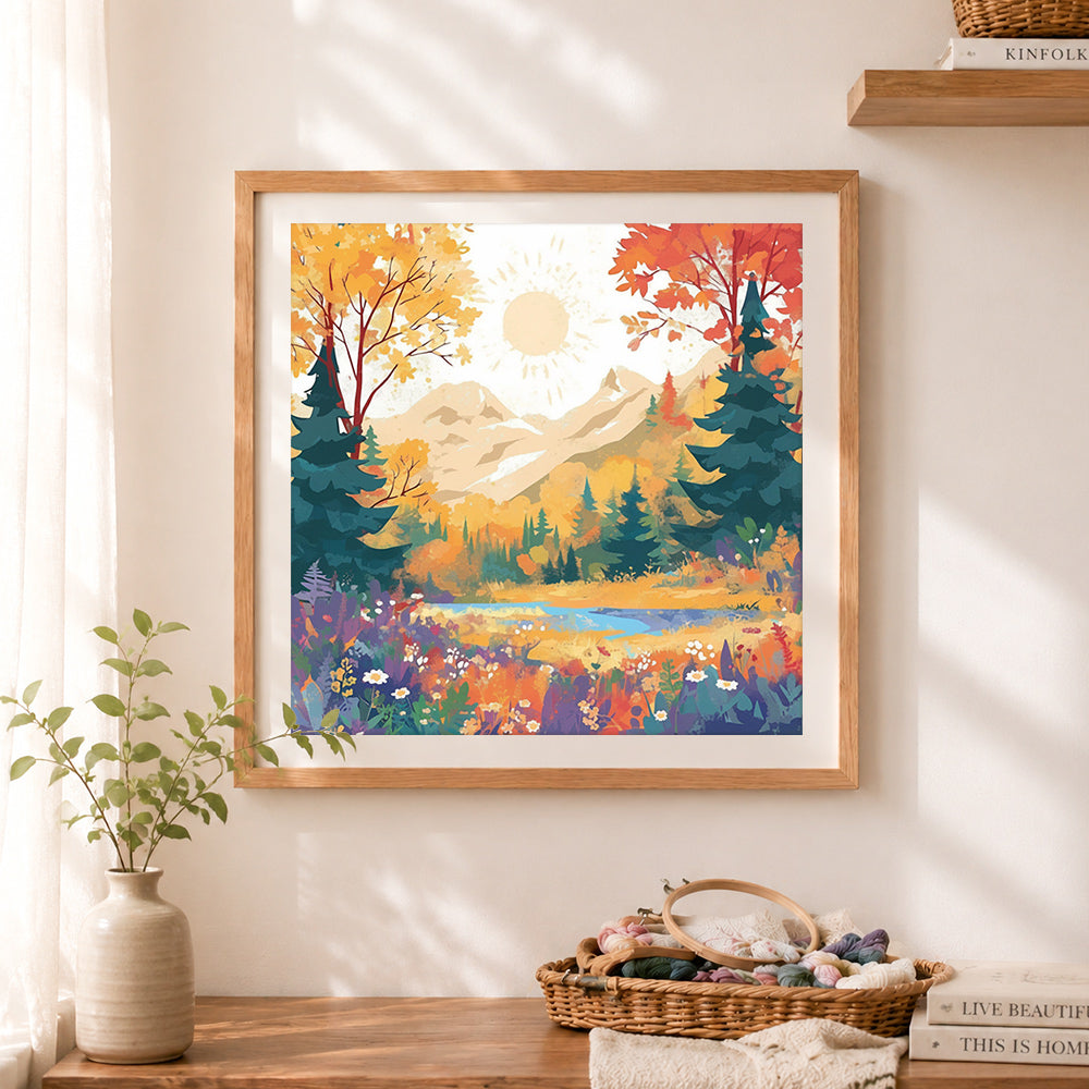 Finished autumn mountain landscape cross stitch artwork displayed as home decor