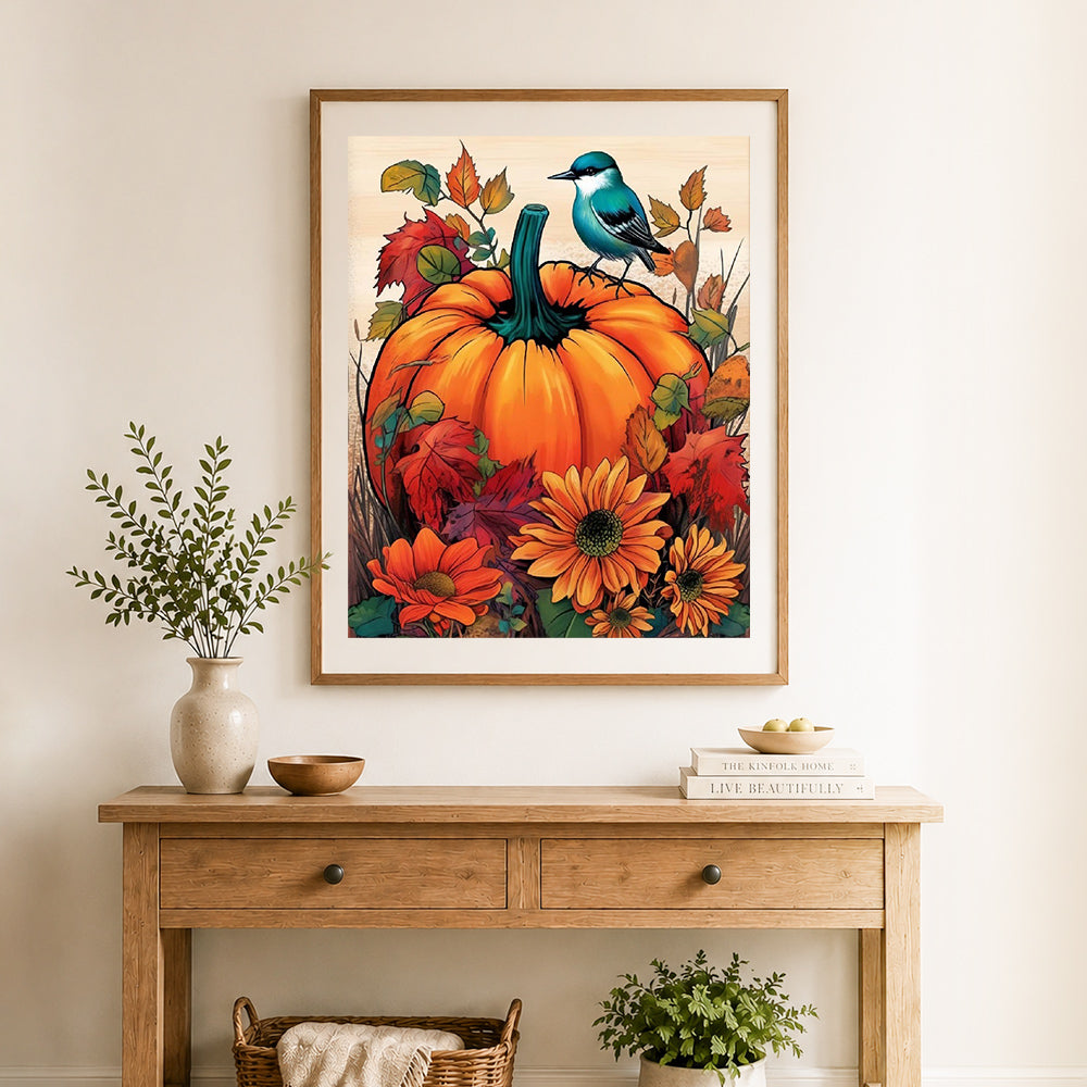 Finished autumn pumpkin and blue bird cross stitch artwork displayed as home decor