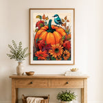 Finished autumn pumpkin and blue bird cross stitch artwork displayed as home decor