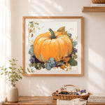 Finished autumn pumpkin and grapes cross stitch artwork displayed as home decor
