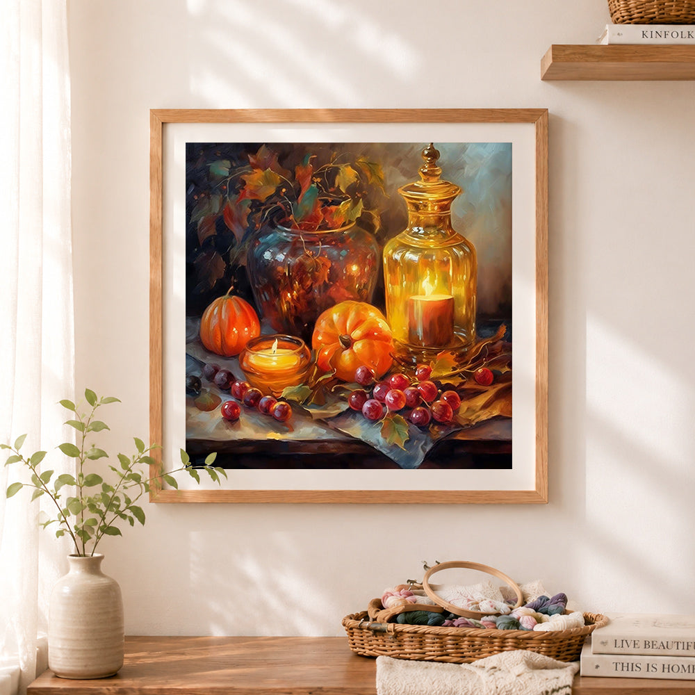 Finished autumn pumpkin candle still life cross stitch artwork displayed as home decor