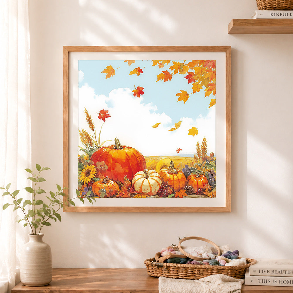 Finished autumn pumpkin harvest cross stitch artwork displayed as home decor