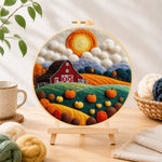 Finished autumn pumpkin harvest farm needle felting displayed on a wooden easel