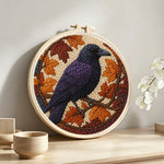 Autumn raven punch needle artwork displayed on a table
