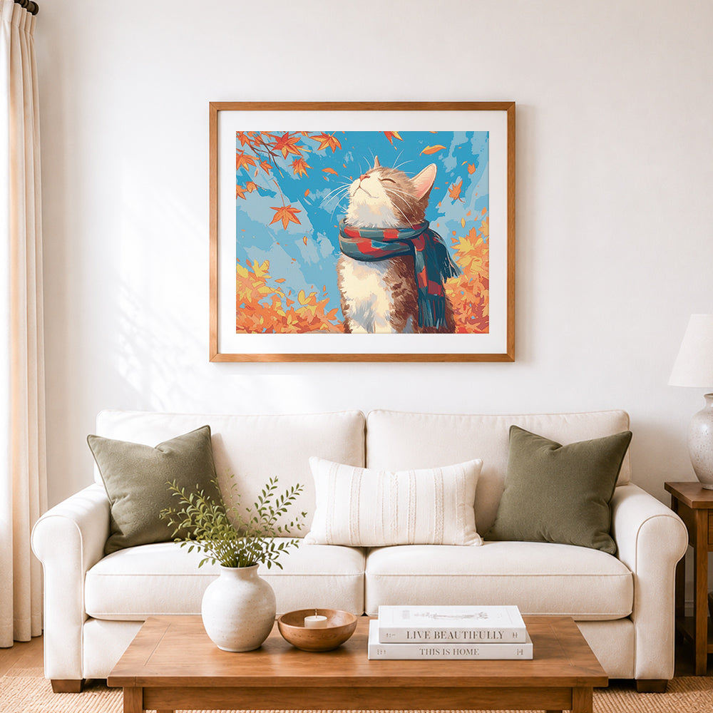 Finished autumn scarf kitty cross stitch artwork displayed as home decor