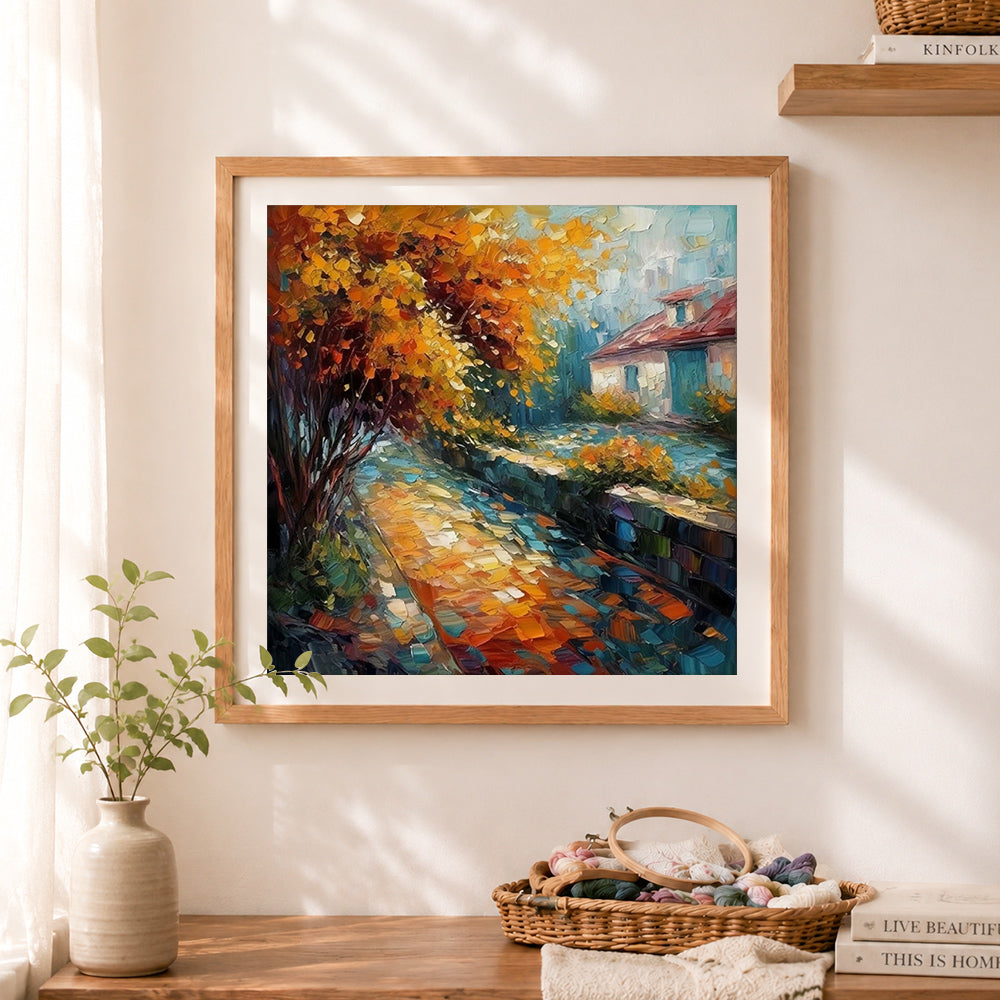 Finished autumn village lane cross stitch artwork displayed as home decor