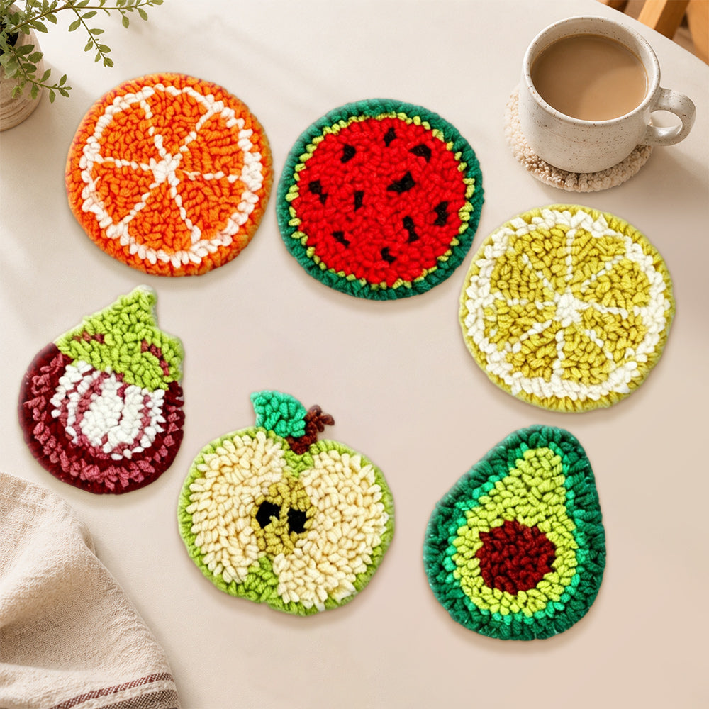 Avocado, fig and citrus punch needle coasters used for home decoration