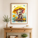 Finished baby elephant under leaf cross stitch artwork displayed as home decor