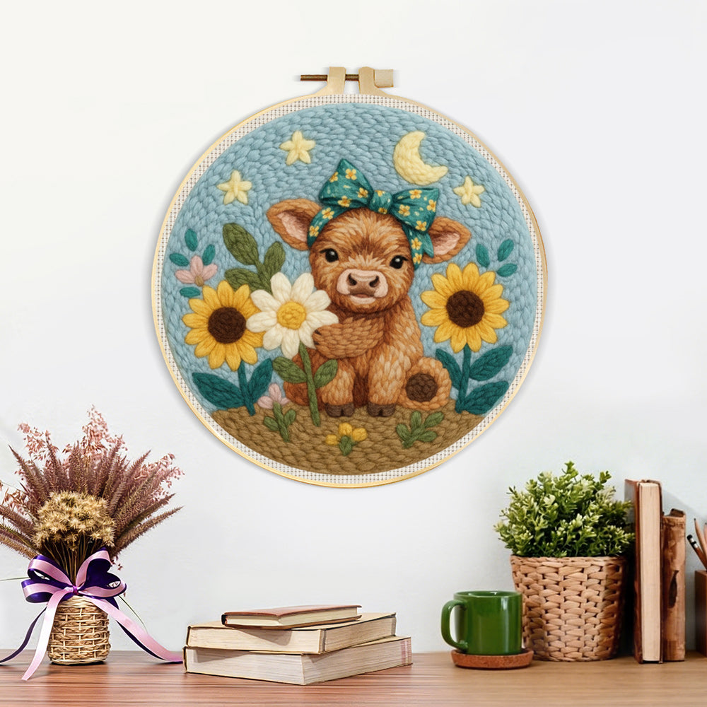 Finished baby highland cow and sunflowers artwork displayed on a wall