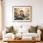 Finished baby otter in wild flowers cross stitch artwork displayed as home decor