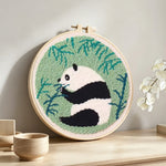Bamboo lover panda punch needle artwork displayed on a table