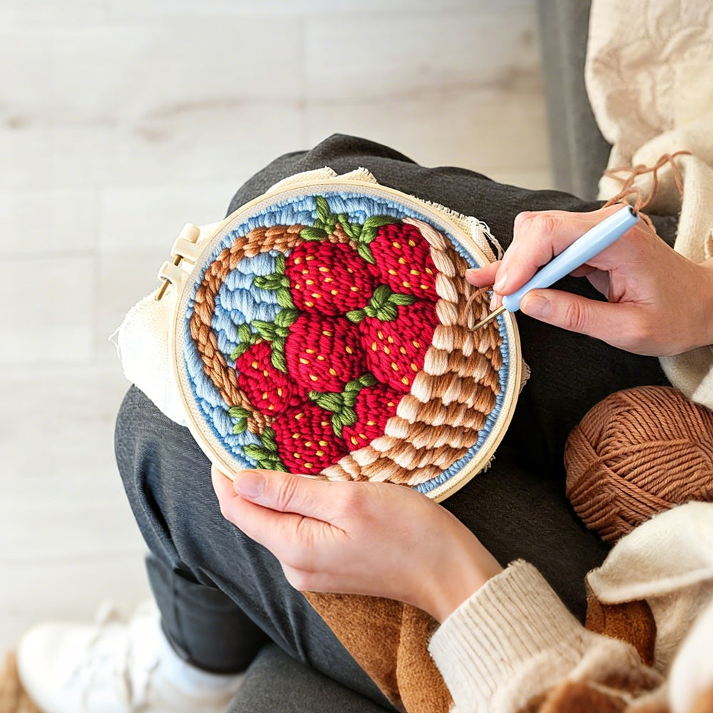 Creating handmade basket of fresh strawberries punch needle artwork