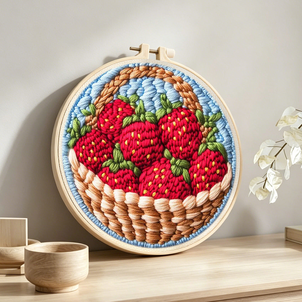 Basket of fresh strawberries punch needle artwork displayed on a table