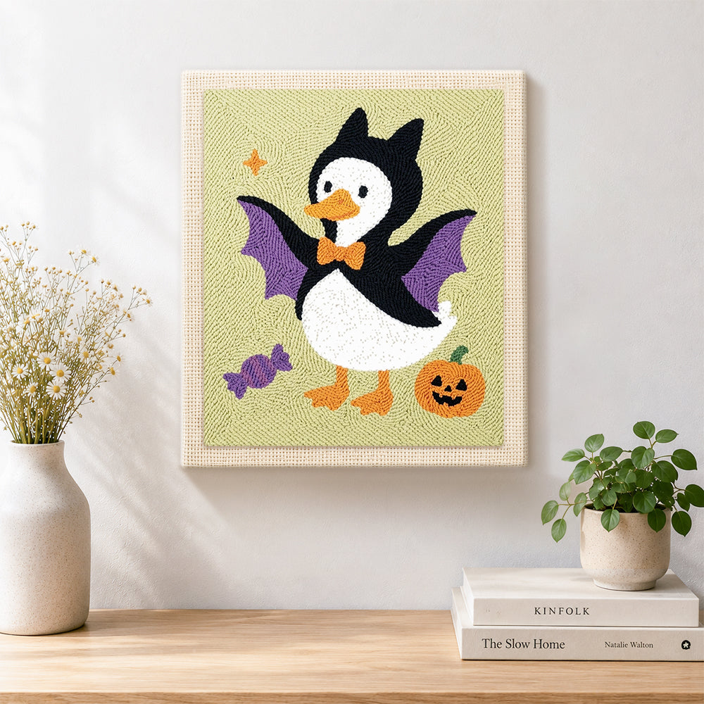 Finished bat costume duck artwork displayed on a wall