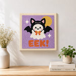 Finished bat costume ghost artwork displayed on a wall